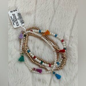 ON 34th NWT BRACELET SET FEATURES BEADS AND MINI TASSELS.
